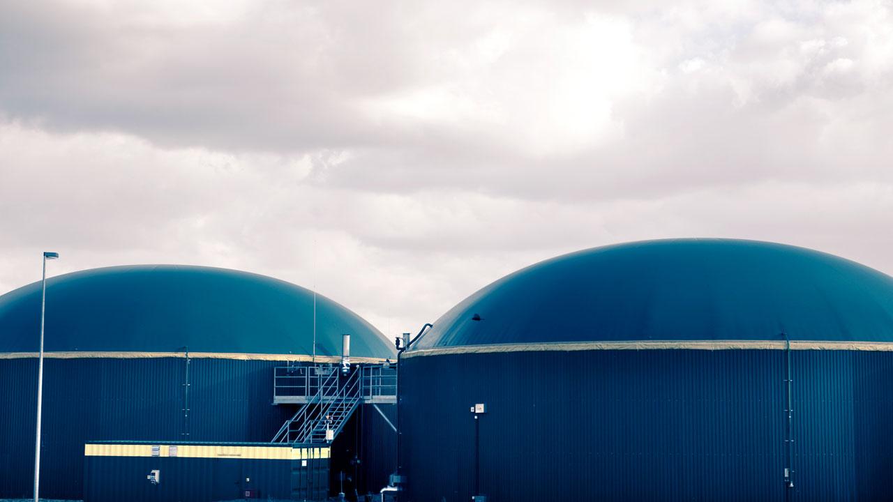 Anaerobic digester with a sky in the background