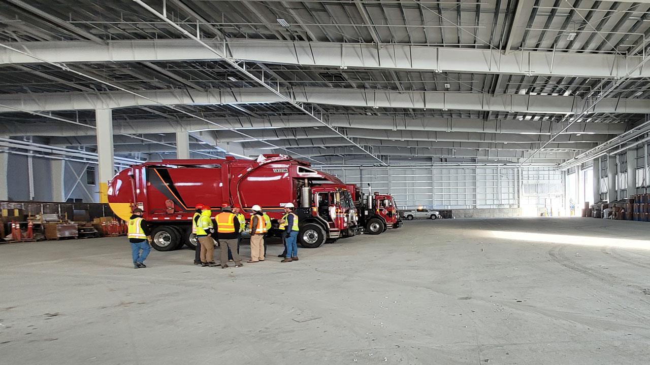 Construction inspectors certifying a transfer facility has been completed in compliance with construction plans